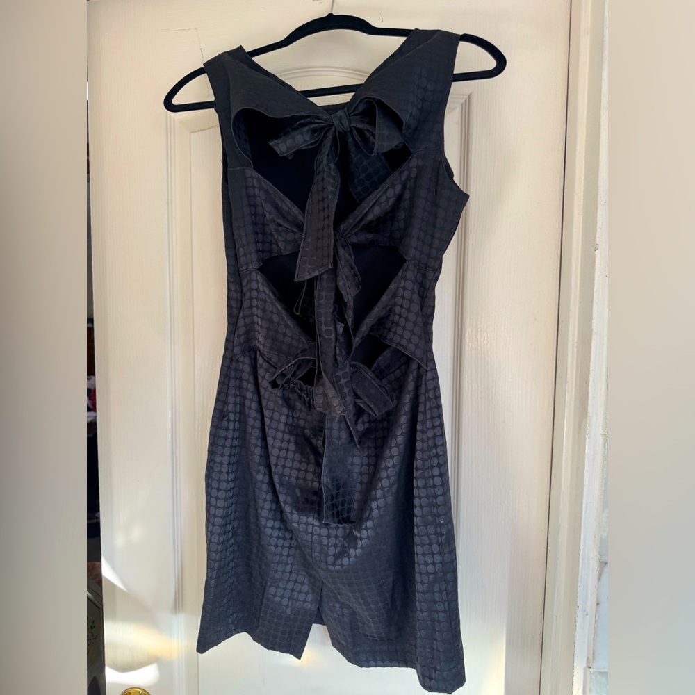 Little black dress by Luce. Size medium. High neck mini dress with 3 back ties